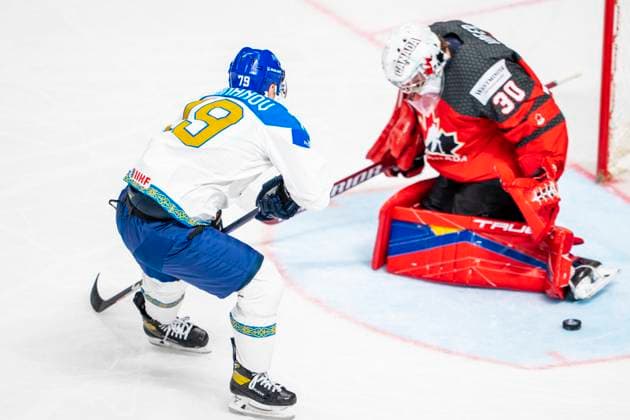 RIGA, LATVIA MAY 17 Mikhail Rakhmanov of Kazakhstan L against goalkeeper Joel Hofer of Canada R during the 2023 IIHF Ice Hockey World Championship Finland Latvia game between Canada and Kazakhstan at Arena Riga on May 17, 2023 in Riga, Latvia Riga Arena Riga Latvia  Copyright: xJustPictures.ch JarixPestelaccix