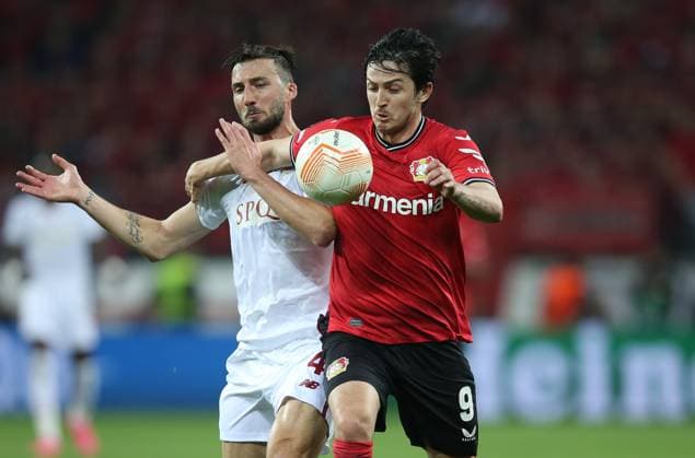 Bayer 04 Leverkusen v AS Roma, UEFA Europa League, Semi finals, 2nd leg, Bay Arena, Cologne, Germany, 18th May 2023 Sardar Azmoun of Bayer Leverkusen battles Bryan Cristante of Roma. - Bayer 04 Leverkusen v AS Roma, UEFA Europa League, Semi finals, 2nd leg, Bay Arena, Cologne, Germany. - 18th May 2023. Cologne Bay Arena Germnay Copyright: xDanxWeirx CP_Bayer_Leverkusen_AS_Roma_36