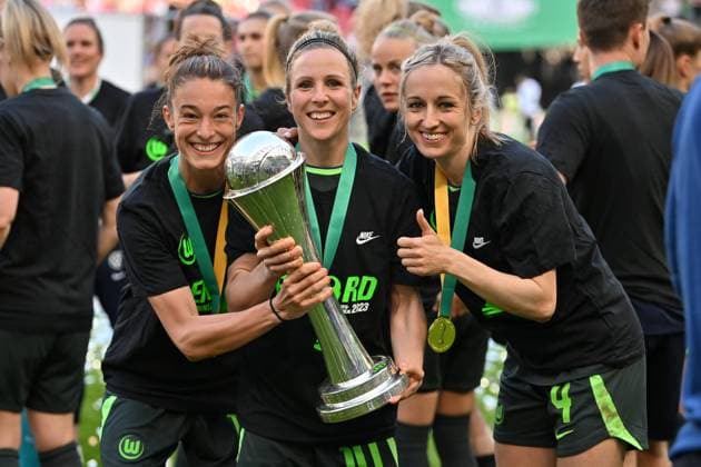 Felicitas Rauch VfL Wolfsburg, 13 Svenja Huth VfL Wolfsburg, 10 Kathrin Hendrich VfL Wolfsburg, 4 beaming into the camera with the DFB Pokal, 18 05 2023, Cologne Germany , Soccer, DFB Pokalfinale der Frauen VFL Wolfsburg SC Freiburg, DFB DFL REGULATIONS PROHIBIT ANY USE OF PHOTOGRAPHS AS IMAGE SEQUENCES AND OR QUASI VIDEO xmkx