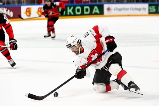 RIGA, LATVIA MAY 20 Andres Ambuhl of Switzerland controls the puck during the 2023 IIHF Ice Hockey World Championship Finland Latvia game between Canada Switzerland at Arena Riga on May 20, 2023 in Riga, Latvia Riga Arena Riga Latvia  Copyright: xJustPictures.ch AndreaxBrancax