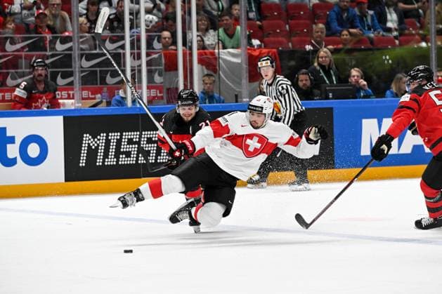 RIGA, LATVIA MAY 20 Kevin Fiala of Switzerland battles for the puck against Scott Laughton of Canada during the 2023 IIHF Ice Hockey World Championship Finland Latvia game between Canada Switzerland at Arena Riga on May 20, 2023 in Riga, Latvia Riga Arena Riga Latvia  Copyright: xJustPictures.ch AndreaxBrancax
