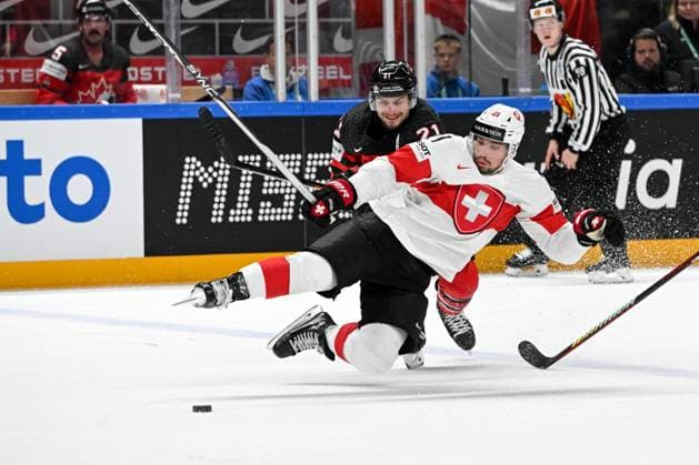RIGA, LATVIA MAY 20 Kevin Fiala of Switzerland battles for the puck against Scott Laughton of Canada during the 2023 IIHF Ice Hockey World Championship Finland Latvia game between Canada Switzerland at Arena Riga on May 20, 2023 in Riga, Latvia Riga Arena Riga Latvia  Copyright: xJustPictures.ch AndreaxBrancax