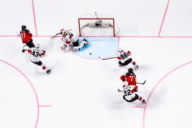 RIGA, LATVIA MAY 20 Janis Moser of Switzerland L helping goalkeeper Leonardo Genoni of Switzerland during the 2023 IIHF Ice Hockey World Championship Finland Latvia game between Canada Switzerland at Arena Riga on May 20, 2023 in Riga, Latvia Riga Arena Riga Latvia  Copyright: xJustPictures.ch JarixPestelaccix