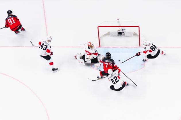 RIGA, LATVIA MAY 20 Janis Moser of Switzerland L helping goalkeeper Leonardo Genoni of Switzerland during the 2023 IIHF Ice Hockey World Championship Finland Latvia game between Canada Switzerland at Arena Riga on May 20, 2023 in Riga, Latvia Riga Arena Riga Latvia  Copyright: xJustPictures.ch JarixPestelaccix