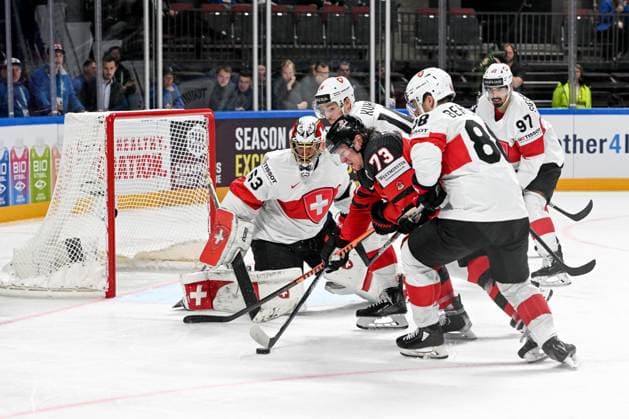 RIGA, LATVIA MAY 20 Tyler Toffoli of Canada tries to score against goalkeeper Leonardo Genoni of Switzerland during the 2023 IIHF Ice Hockey World Championship Finland Latvia game between Canada Switzerland at Arena Riga on May 20, 2023 in Riga, Latvia Riga Arena Riga Latvia  Copyright: xJustPictures.ch AndreaxBrancax