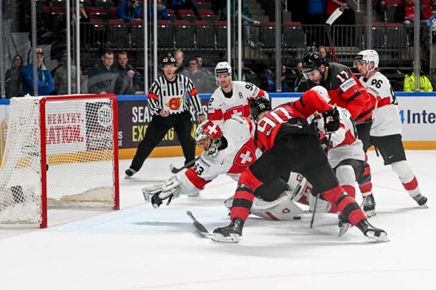 RIGA, LATVIA MAY 20 Joe Veleno of Canada tries to score against goalkeeper Leonardo Genoni of Switzerland during the 2023 IIHF Ice Hockey World Championship Finland Latvia game between Canada Switzerland at Arena Riga on May 20, 2023 in Riga, Latvia Riga Arena Riga Latvia  Copyright: xJustPictures.ch AndreaxBrancax