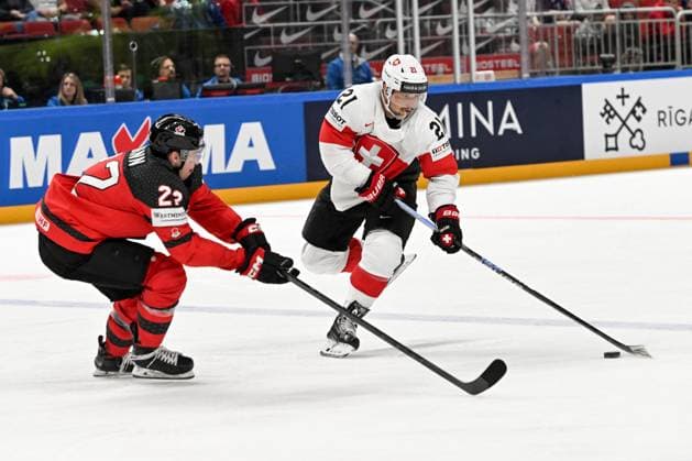 RIGA, LATVIA MAY 20 Kevin Fiala of Switzerland enters the offensive zone against Jack Quinn of Canada during the 2023 IIHF Ice Hockey World Championship Finland Latvia game between Canada Switzerland at Arena Riga on May 20, 2023 in Riga, Latvia Riga Arena Riga Latvia  Copyright: xJustPictures.ch AndreaxBrancax
