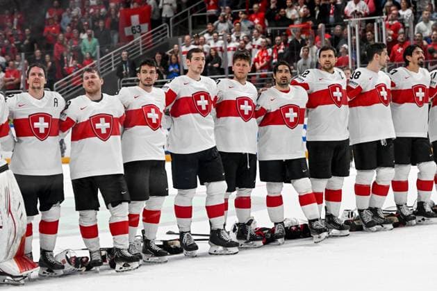 RIGA, LATVIA MAY 20 Swiss players listen to the national anthem during the 2023 IIHF Ice Hockey World Championship Finland Latvia game between Canada Switzerland at Arena Riga on May 20, 2023 in Riga, Latvia Riga Arena Riga Latvia  Copyright: xJustPictures.ch AndreaxBrancax