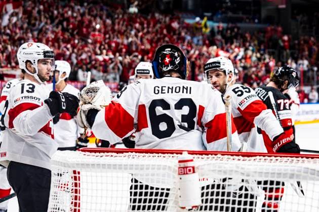 RIGA, LATVIA MAY 20 Nico Hischier of Switzerland L and Romain Loeffel of Switzerland R celebrates victory with goalkeeper Leonardo Genoni of Switzerland C during the 2023 IIHF Ice Hockey World Championship Finland Latvia game between Canada Switzerland at Arena Riga on May 20, 2023 in Riga, Latvia Riga Arena Riga Latvia  Copyright: xJustPictures.ch JarixPestelaccix