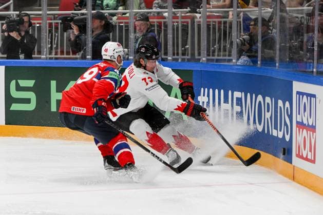 RIGA, LATVIA MAY 22 Tyler Toffoli of Canada and Christian Kaasastul of Norway battle for the puck during the 2023 IIHF Ice Hockey World Championship Finland Latvia game between Canada and Norway at Arena Riga on May 22, 2023 in Riga, Latvia Riga Arena Riga Latvia  Copyright: xJustPictures.ch AndreaxBrancax