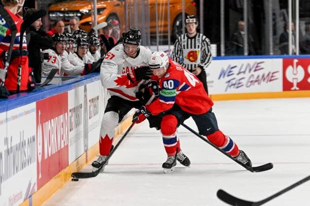 RIGA, LATVIA MAY 22 Tyler Myers of Canada and Ken Andre Olimb of Norway battle for the puck along the boards during the 2023 IIHF Ice Hockey World Championship Finland Latvia game between Canada and Norway at Arena Riga on May 22, 2023 in Riga, Latvia Riga Arena Riga Latvia  Copyright: xJustPictures.ch AndreaxBrancax