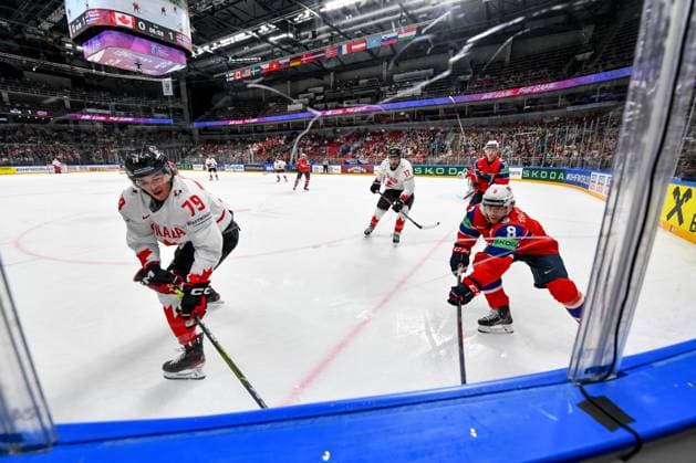 RIGA, LATVIA MAY 22 Samuel Blais of Canada fight with Mathias Trettenes of Norway for the puck possession during the 2023 IIHF Ice Hockey World Championship Finland Latvia game between Canada and Norway at Arena Riga on May 22, 2023 in Riga, Latvia Riga Arena Riga Latvia  Copyright: xJustPictures.ch AndreaxBrancax