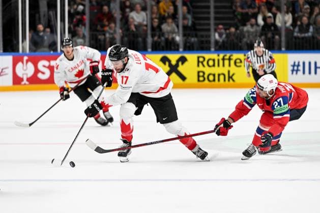 RIGA, LATVIA MAY 22 Milan Lucic of Canada defends the puck against Andreas Martinsen of Norway during the 2023 IIHF Ice Hockey World Championship Finland Latvia game between Canada and Norway at Arena Riga on May 22, 2023 in Riga, Latvia Riga Arena Riga Latvia  Copyright: xJustPictures.ch AndreaxBrancax