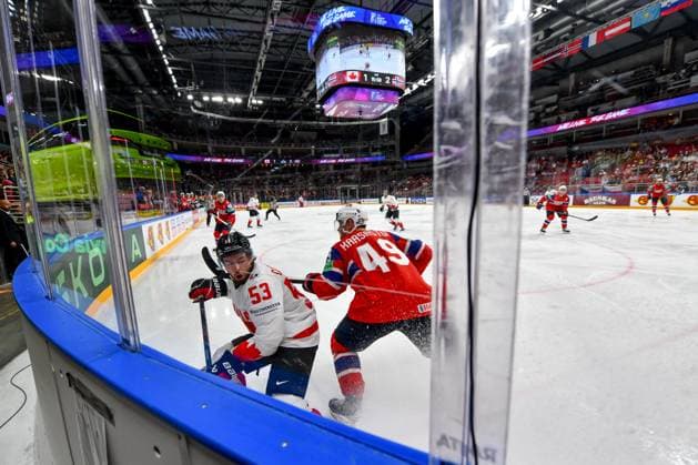 RIGA, LATVIA MAY 22 Michael Carcone of Canada battle along the boards against Christian Kaasastul of Norway during the 2023 IIHF Ice Hockey World Championship Finland Latvia game between Canada and Norway at Arena Riga on May 22, 2023 in Riga, Latvia Riga Arena Riga Latvia  Copyright: xJustPictures.ch AndreaxBrancax