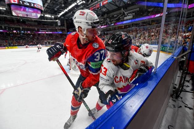 RIGA, LATVIA MAY 22 Michael Carcone of Canada and Markus Vikingstad of Norway battle along the boards during the 2023 IIHF Ice Hockey World Championship Finland Latvia game between Canada and Norway at Arena Riga on May 22, 2023 in Riga, Latvia Riga Arena Riga Latvia  Copyright: xJustPictures.ch AndreaxBrancax