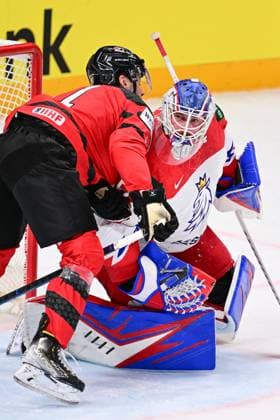 From left Adam Fantilli of Canda and Czech goalie Karel Vejmelka in action during the IIHF Ice hockey, Eishockey World Championship, WM, Weltmeisterschaft Group B match Czech Republic vs Canada, in Riga, Latvia, May 23, 2023. (CTKxPhoto DavidxTanecek) CTKPhotoP2023052306209  CTKPhotoP2023052306209