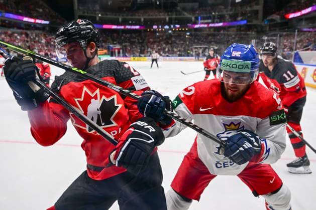 From left Justin Barron of Canada and Czech Michael Spacek in action during the IIHF Ice hockey, Eishockey World Championship, WM, Weltmeisterschaft Group B match Czech Republic vs Canada, in Riga, Latvia, May 23, 2023. (CTKxPhoto DavidxTanecek) CTKPhotoP2023052306784  CTKPhotoP2023052306784