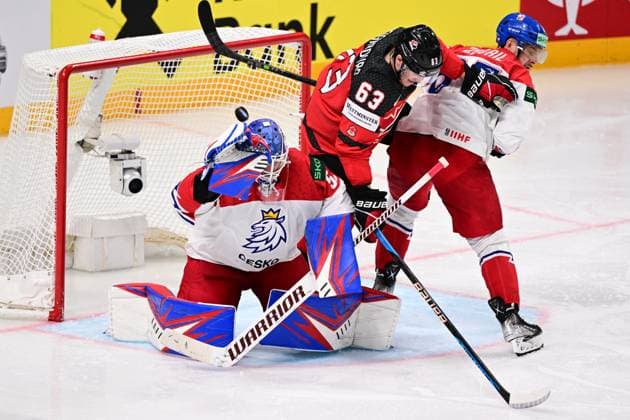 From left Czech goalie Karel Vejmelka, Jake Neighbours of Canada and Czech Jakub Zboril in action during the IIHF Ice hockey, Eishockey World Championship, WM, Weltmeisterschaft Group B match Czech Republic vs Canada, in Riga, Latvia, May 23, 2023. (CTKxPhoto DavidxTanecek) CTKPhotoP2023052306974  CTKPhotoP2023052306974