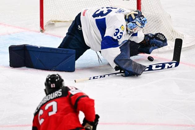 L-R Jake Neighbours (CAN) and goalkeeper Emil Larmi (FIN) in action during the quarter-final match Canada vs Finland, within the IIHF Ice hockey, Eishockey World Championship, WM, Weltmeisterschaft on May 24, 2023, in Tampere, Finland. (CTKxPhoto DavidxTanecek) CTKPhotoP2023052509142  CTKPhotoP2023052509142