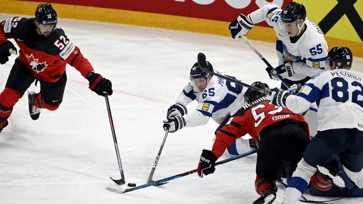 MacKenzie Weegar (left) and Michael Carcone of Canada in action against Sakari Manninen (2nd left), Atte Ohtamaa and Harri Pesonen of Finland (right( the 2023 IIHF Ice hockey, Eishockey World Championships quarterfinal match between Canada and Finland in Tampere on May 25, 2023. Tampere Finland LKFTJK20230525203534YJMV  Copyright: xJussixNukarix LKFTJK20230525203534YJMV
