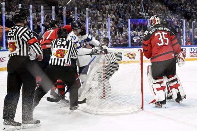 Tyler Myers of Canada (left) and Teemu Hartikainen of Finland scuffle and goalkeeper Samuel Montembeault of Canada looks on during the 2023 IIHF Ice hockey, Eishockey World Championships quarterfinal match between Canada and Finland in Tampere on May 25, 2023. Tampere Finland LKFTJK20230525204658OYOB  Copyright: xEmmixKorhonenx LKFTJK20230525204658OYOB