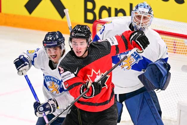 L-R Hannes Bjorninen (FIN), Cody Glass (CAN) and goalkeeper Emil Larmi (FIN) in action during the quarter-final match Canada vs Finland, within the IIHF Ice hockey, Eishockey World Championship, WM, Weltmeisterschaft on May 24, 2023, in Tampere, Finland. (CTKxPhoto DavidxTanecek) CTKPhotoP2023052509530  CTKPhotoP2023052509530
