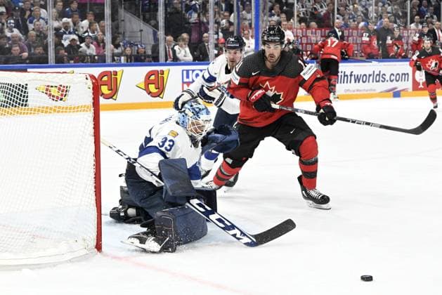 Goalkeeper Emil Larmi of Finland makes a save on Jack McBain (R) of Canada during the 2023 IIHF Ice hockey, Eishockey World Championships quarterfinal match between Canada and Finland in Tampere on May 25, 2023, background Mikael Seppälä of Finland. Tampere Finland LKFTJK20230525214152NAZQ  Copyright: xEmmixKorhonenx LKFTJK20230525214152NAZQ