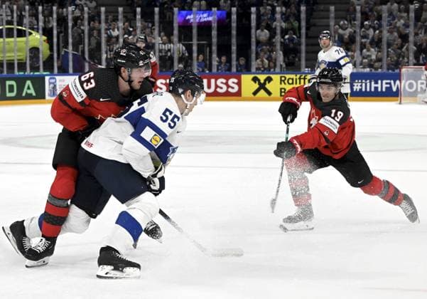 Canada s Jake Neighbours (L) and Peyton Krebs with Atte Ohtamaa (55) of Finland during the 2023 IIHF Ice hockey, Eishockey World Championships quarterfinal match between Canada and Finland in Tampere on May 25, 2023. Tampere Finland LKFTJK20230525214631PHLG  Copyright: xJussixNukarix LKFTJK20230525214631PHLG