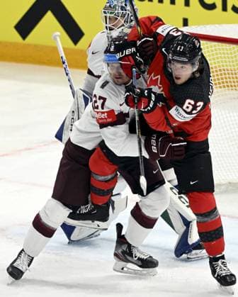 Oskars Cibulskis (L) of Latvia vies with Jake Neighbours of Canada during the 2023 IIHF Ice hockey, Eishockey World Championships semifinal match between Canada and Latvia in Tampere on May 27, 2023. Tampere Finland LKFTJK20230527142847RFEX  Copyright: xJussixNukarix LKFTJK20230527142847RFEX