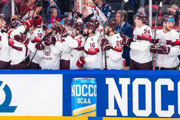 RIGA, LATVIA MAY 27 Latvia squad celebrates the 1 0 of Dans Locmelis of Latvia not pictured during the 2023 IIHF Ice Hockey World Championship Finland Latvia game between Canada and Latvia at Nokia Arena on May 27, 2023 in Tampere, Finland Tampere Finland  Copyright: xJustPictures.ch JarixPestelaccix