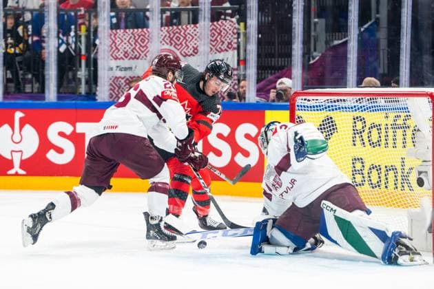 RIGA, LATVIA MAY 27 Samuel Blais of Canada C blocked by Uvis Janis Balinskis of Latvia L during the 2023 IIHF Ice Hockey World Championship Finland game between Canada and Latvia at Nokia Arena on May 27, 2023 in Tampere, Finland Tampere Finland  Copyright: xJustPictures.ch JarixPestelaccix