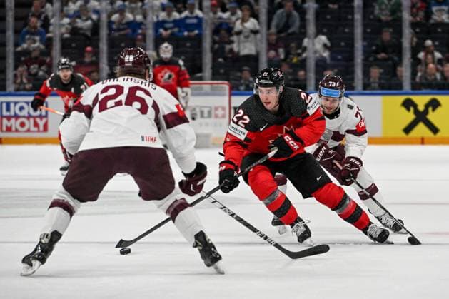 RIGA, LATVIA MAY 27 Jack Quinn of Canada in action against Deniss Smirnovs of Latvia and Uvis Janis Balinskis of Latvia during the 2023 IIHF Ice Hockey World Championship Finland game between Canada and Latvia at Nokia Arena on May 27, 2023 in Tampere, Finland Tampere Finland  Copyright: xJustPictures.ch AndreaxBrancax
