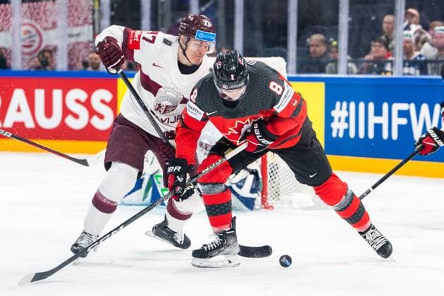 RIGA, LATVIA MAY 27 Cody Glass of Canada R against Kristaps Roberts Zile of Latvia L during the 2023 IIHF Ice Hockey World Championship Finland Latvia game between Canada and Latvia at Nokia Arena on May 27, 2023 in Tampere, Finland Tampere Finland  Copyright: xJustPictures.ch JarixPestelaccix