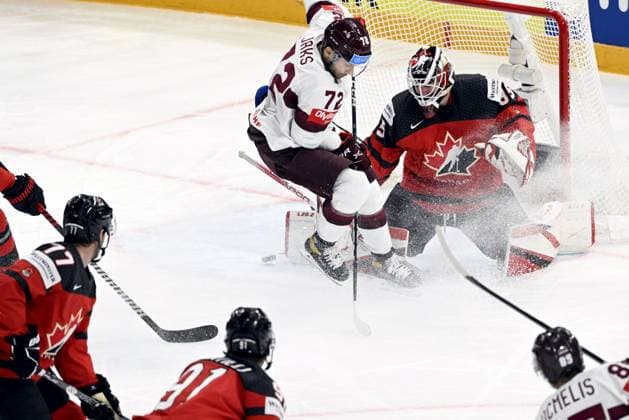 Goalkeeper Samuel Montembeault of Canada saves against Janis Jaks of Latvia during the 2023 IIHF Ice hockey, Eishockey World Championships semifinal match between Canada and Latvia in Tampere on May 27, 2023. Tampere Finland LKFTJK20230527152314UGJV  Copyright: xJussixNukarix LKFTJK20230527152314UGJV