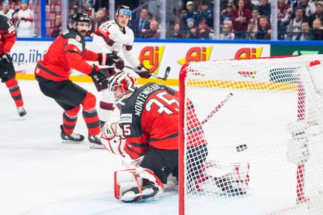 RIGA, LATVIA MAY 27 goalkeeper Samuel Montembeault of Canada can™t save on Rudolfs Balcers of Latvia during the 2023 IIHF Ice Hockey World Championship Finland game between Canada and Latvia at Nokia Arena on May 27, 2023 in Tampere, Finland Tampere Finland  Copyright: xJustPictures.ch JarixPestelaccix