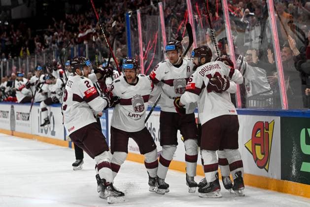 RIGA, LATVIA MAY 27 Latvia celebrate after a goal scored by Rudolfs Balcers of Latvia during the 2023 IIHF Ice Hockey World Championship Finland Latvia game between Canada and Latvia at Nokia Arena on May 27, 2023 in Tampere, Finland Tampere Finland  Copyright: xJustPictures.ch AndreaxBrancax