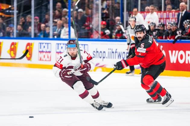 RIGA, LATVIA MAY 27 Roberts Bukarts of Latvia L against Jacob Middleton of Canada R during the 2023 IIHF Ice Hockey World Championship Finland Latvia game between Canada and Latvia at Nokia Arena on May 27, 2023 in Tampere, Finland Tampere Finland  Copyright: xJustPictures.ch JarixPestelaccix