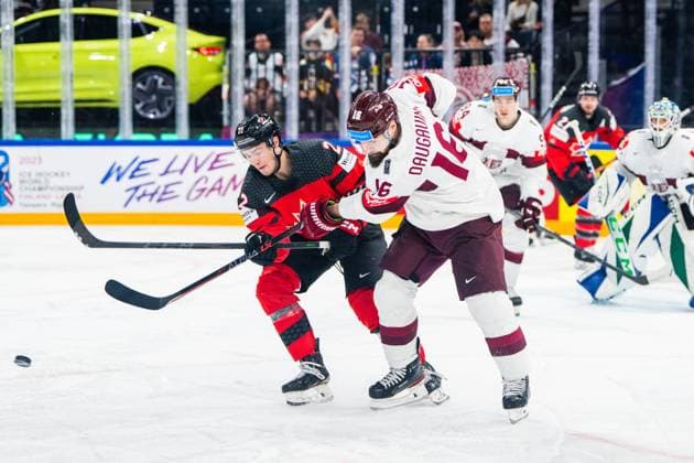 RIGA, LATVIA MAY 27 Kaspars Daugavins of Latvia R against Jack Quinn of Canada L during the 2023 IIHF Ice Hockey World Championship Finland Latvia game between Canada and Latvia at Nokia Arena on May 27, 2023 in Tampere, Finland Tampere Finland  Copyright: xJustPictures.ch JarixPestelaccix