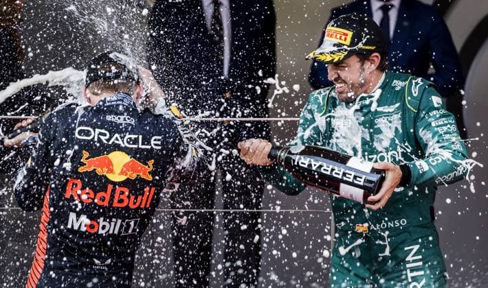 MONACO - Max Verstappen (Red Bull Racing) and Fernando Alonso (Aston Martin) on the podium after the Monaco Grand Prix. ANP REMKO DE WAAL netherlands out - belgium out MONACO xVIxxIVx 470423223 originalFilename: 0258129603st.jpg