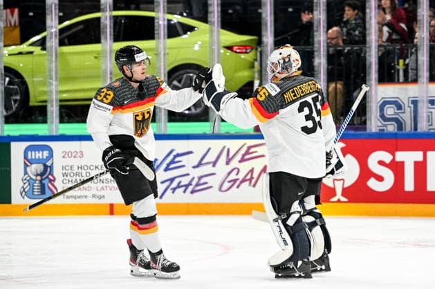 TAMPERE, FINLAND MAY 28 John Peterka of Germany L celebrate after scoring a goal with teammate goalkeeper Mathias Niederberger of Germany R during the 2023 IIHF Ice Hockey World Championship Finland Latvia game between Canada and Germany at Nokia Arena on May 28, 2023 in Tampere, Finland Tampere Nokia Arena Finland  Copyright: xJustPictures.ch AndreaxBrancax