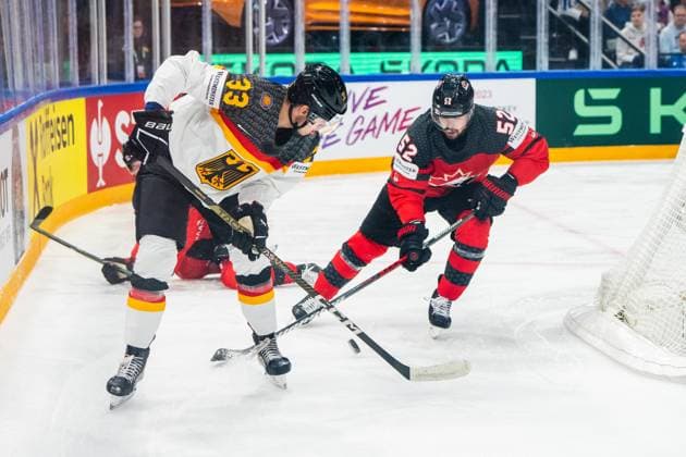 TAMPERE, FINLAND MAY 28 John Peterka of Germany L against MacKenzie Weegar of Canada R during the 2023 IIHF Ice Hockey World Championship Finland Latvia game between Canada and Germany at Nokia Arena on May 28, 2023 in Tampere, Finland Tampere Nokia Arena Finland  Copyright: xJustPictures.ch JarixPestelaccix