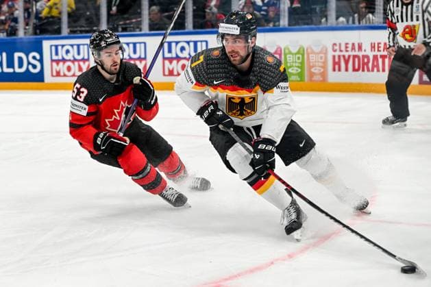 TAMPERE, FINLAND MAY 28 Maximilian Kastner of Germany protects the puck against Michael Carcone of Canada during the 2023 IIHF Ice Hockey World Championship Finland Latvia game between Canada and Germany at Nokia Arena on May 28, 2023 in Tampere, Finland Tampere Nokia Arena Finland  Copyright: xJustPictures.ch AndreaxBrancax