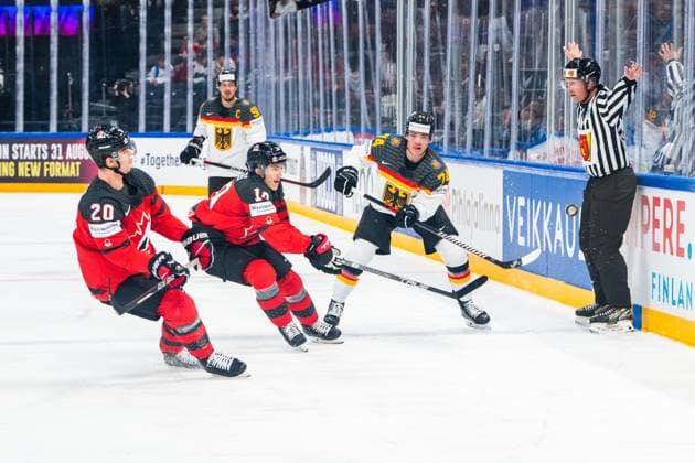 TAMPERE, FINLAND MAY 28 Justin Schutz of Germany R pinch the puck to the corner during the 2023 IIHF Ice Hockey World Championship Finland Latvia game between Canada and Germany at Nokia Arena on May 28, 2023 in Tampere, Finland Tampere Nokia Arena Finland  Copyright: xJustPictures.ch JarixPestelaccix