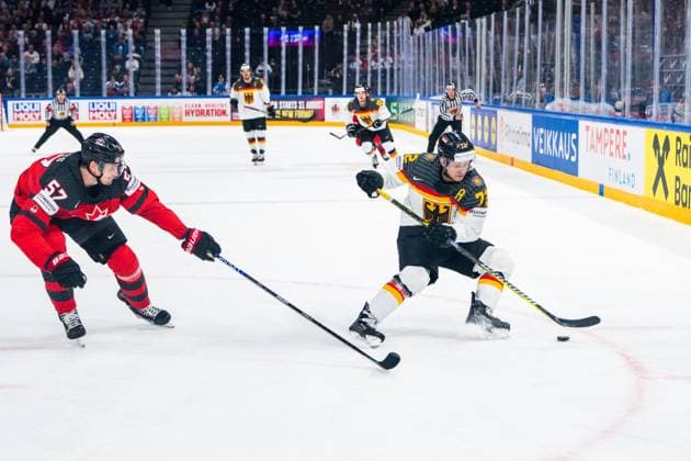TAMPERE, FINLAND MAY 28 Dominik Kahun of Germany R against Tyler Myers of Canada L during the 2023 IIHF Ice Hockey World Championship Finland Latvia game between Canada and Germany at Nokia Arena on May 28, 2023 in Tampere, Finland Tampere Nokia Arena Finland  Copyright: xJustPictures.ch JarixPestelaccix