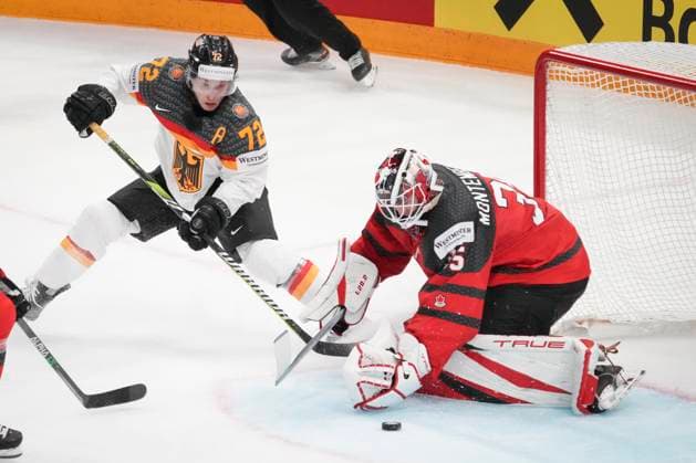Dominik Kahun 72, GER and Sam Montembeault 35, CAN during the 2023 IIHF Ice hockey, Eishockey World Championship, WM, Weltmeisterschaft gold medal match between Canada - Germany at the Nokia Arena on 28. May 2023 in Tampere, Finland. (KALLE PARKKINEN Newspix24)  Copyright: xKallexParkkinenx np24282158700