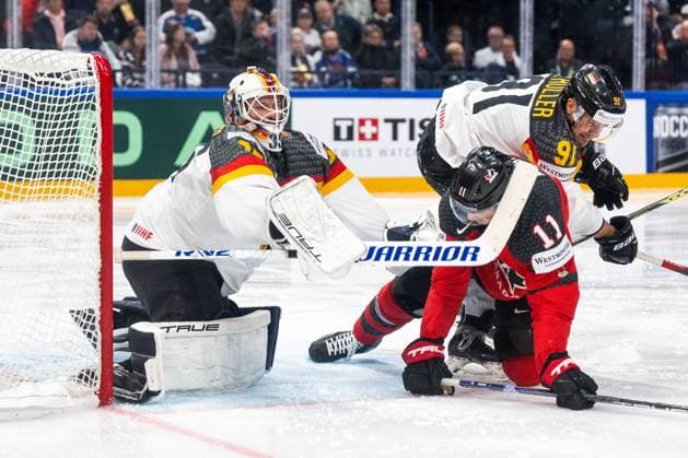230528 Goaltender Mathias Niederberger and Moritz Müller of Germany and Jack McBain of Canada during the 2023 IIHF Ice Hockey World Championship final game between Canada and Germany on May 28, 2023 in Tampere Photo Joel Marklund BILDBYRAN kod JM JM0489 bbeng ishockey ice hockey ice hockey vm 2023 ishockey vm vm vm 2023 iihf ice hockey world championship final canada canada germany germany  Copyright: JOELxMARKLUND BB230528JM130