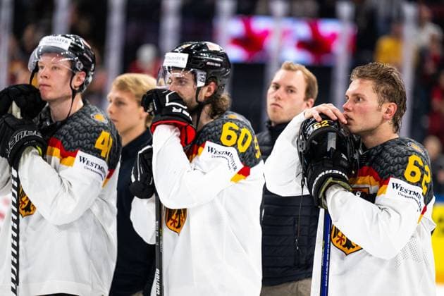 230528 Jonas Müller, Wojciech Stachowiak and Parker Tuomie looks dejected after the 2023 IIHF Ice Hockey World Championship final game between Canada and Germany on May 28, 2023 in Tampere Photo Joel Marklund BILDBYRAN kod JM JM0489 bbeng ishockey ice hockey ishockey vm 2023 ishockey vm vm 2023 iihf ice hockey world championship final canada canada germany germany depp  Copyright: JOELxMARKLUND BB230528JM144