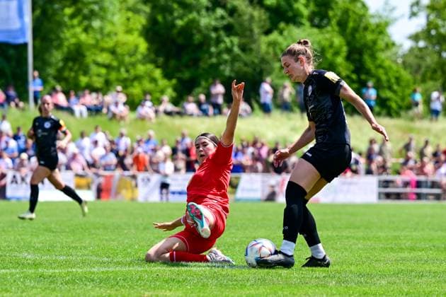 29 05 2023, GER, Soccer, 2 Women Bundesliga 2022 2023, SG 99 Andernach 1 FC Köln U20 Olesja Arslan 14 Köln tries to separate Carolin Schraa 7 Andernach from the ball with a tackle Andernach Stadion Rheinland Pfalz Germany