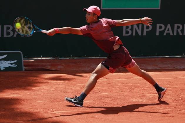 (230529) -- PARIS, May 29, 2023 -- Shang Juncheng of China returns the ball during the men s singles first round match against Juan Pablo Varillas of Peru at the French Open tennis tournament at Roland Garros in Paris, France, May 29, 2023. ) (SP)FRANCE-PARIS-TENNIS-ROLAND GARROS-FRENCH OPEN-MEN S SINGLES GaoxJing 