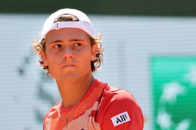 Aleksandar Kovacevic of the US glances at opponent Serbian Novak Djokovic during their first-round match at Roland Garros French Tennis Open in Paris, France, on Monday, May 29, 2023. Djokovic won 6-3, 6-2, 7-6.  PAR20230529527 MAYAxVIDON-WHITE